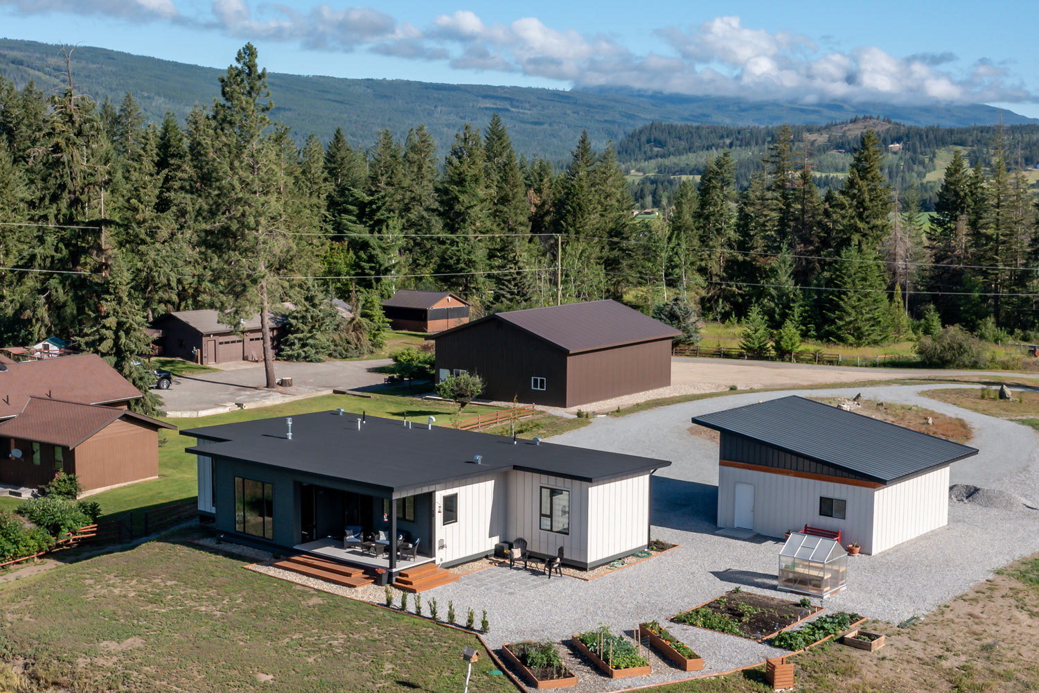 Photo of building a modular home in armstrong, taken on a clear day from a drone 